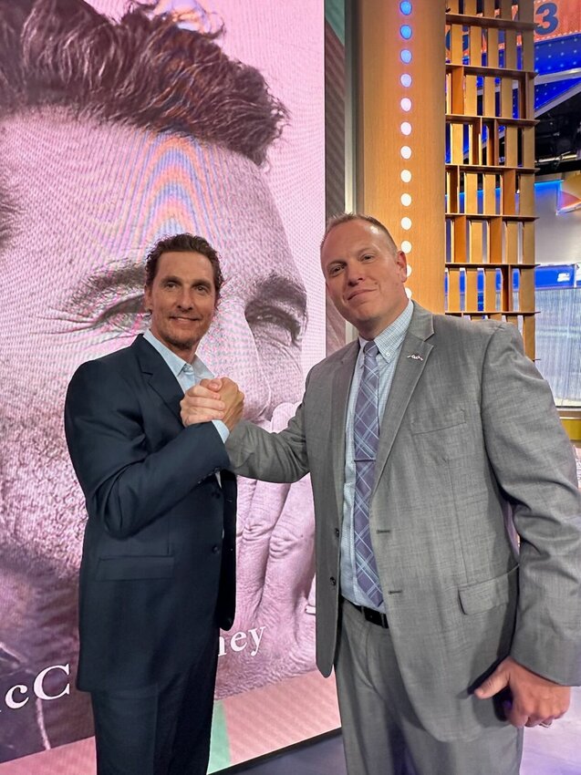 Leeton Superintendent Adam Easterwood, right, shakes hands with actor and Greenlights Grant Initiative's Matthew McConaughey, left, on Tuesday, Sept. 10, in New York. 