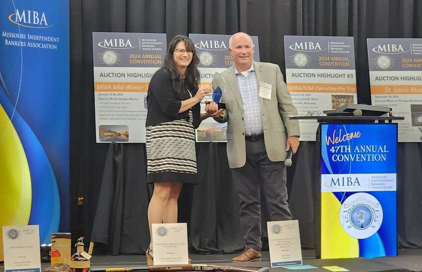 F&C Bank Assistant Vice President for Director of Marketing & Retail Training Jennifer Smithson accepts the Forvis Mazars Community Impact Award. 