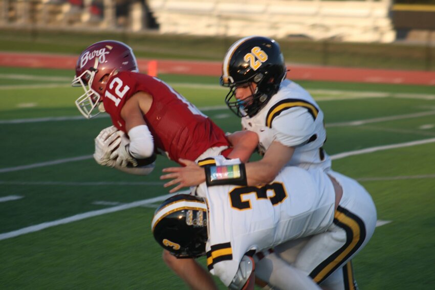 Warrensburg senior Tristan Blew hauls in a reception against Cameron on Friday, Sept. 6, at the Warrensburg Activities Complex.