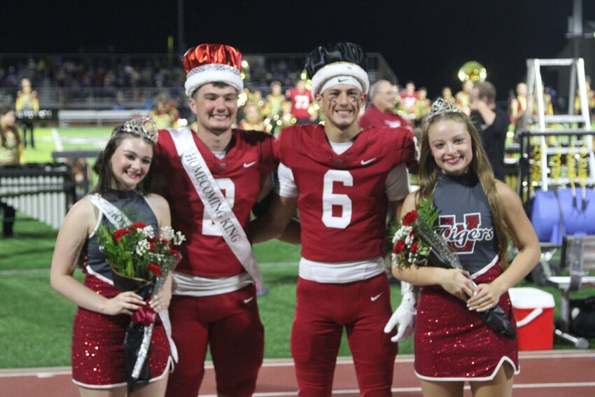 Warrensburg Homecoming Queen Ani Jaccarino, Homecoming King Ryan Munsterman, Homecoming Prince Cruz Villegas and Homecoming Princess Olivia Jayne pose for a photo Friday, Sept. 27, at the Warrensburg Activities Complex.