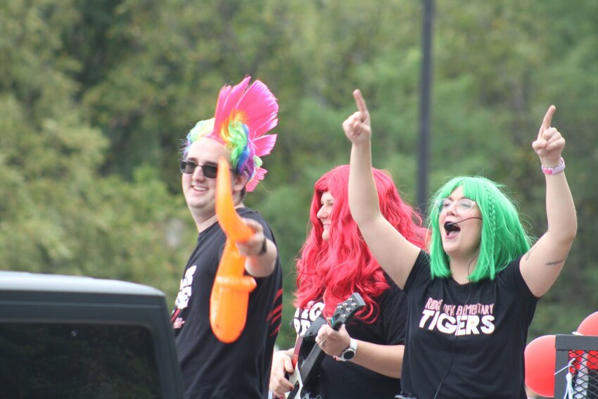 Ridgeview Elementary staff members rock out during the Warrensburg R-VI School District Homecoming Parade on Friday, Sept. 27.