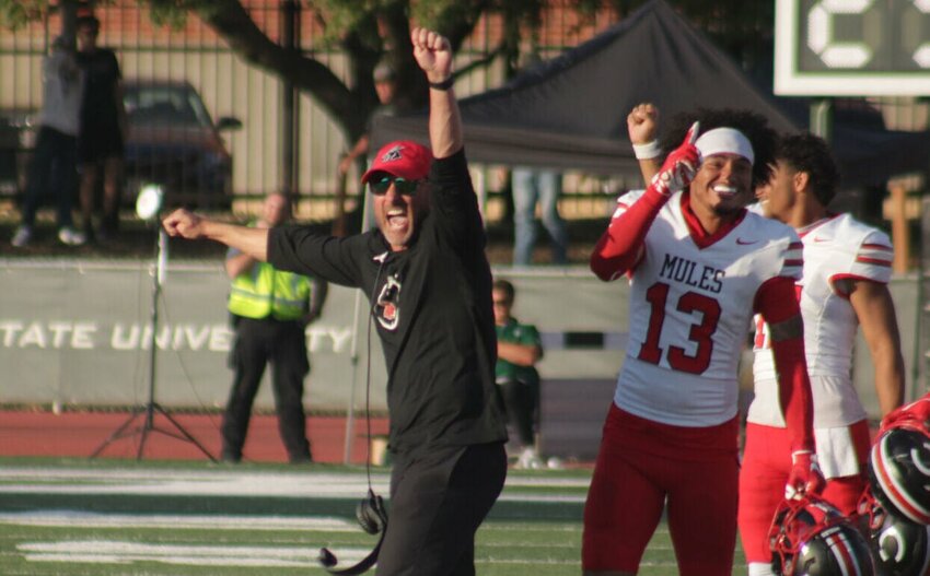 Central Missouri head football coach Josh Lamberson celebrates the Mules' win against Northwest Missouri State Saturday, Oct. 19, at Bearcat Stadium. The victory gave the Mules their first road win against the Bearcats since 2003.&nbsp;