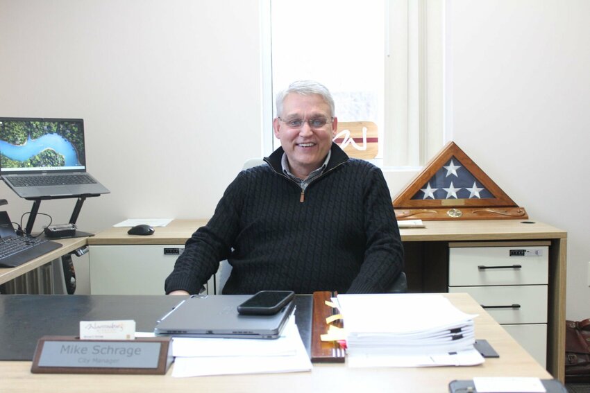 Warrensburg City Manager Mike Schrage poses for a photo on Wednesday, March 5, in his office. Schrage started his new job on Feb. 11 and is taking the job a day at a time.