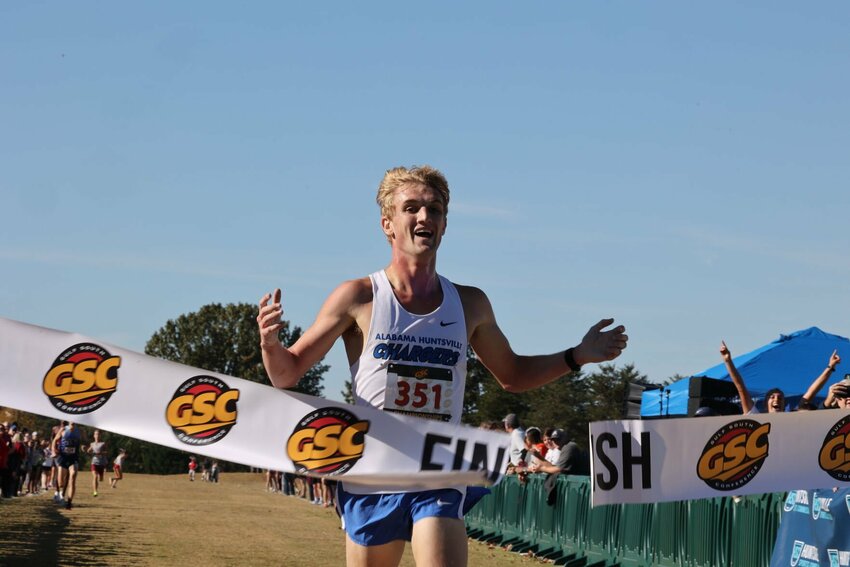 University of Alabama in Huntsville junior Sam Wilhelm crosses the finish line at the Gulf South Conference Cross Country Championships on Oct. 21, 2023, at John Hunt Park in Huntsville, Alabama. &nbsp;