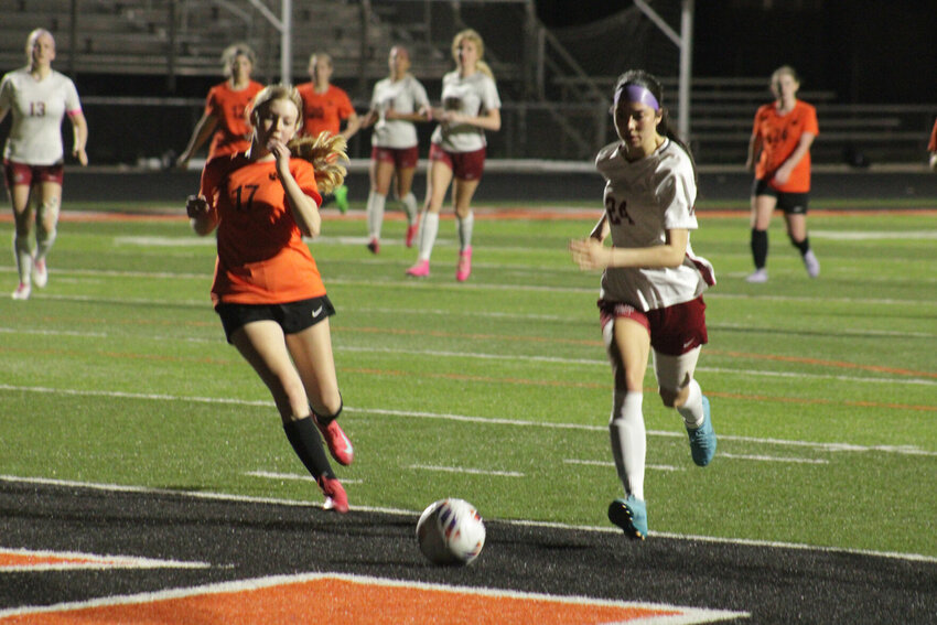Warrensburg sophomore Bella Sanchez dribbles the ball against Oak Grove on Thursday, March 27, at Oak Grove High School.