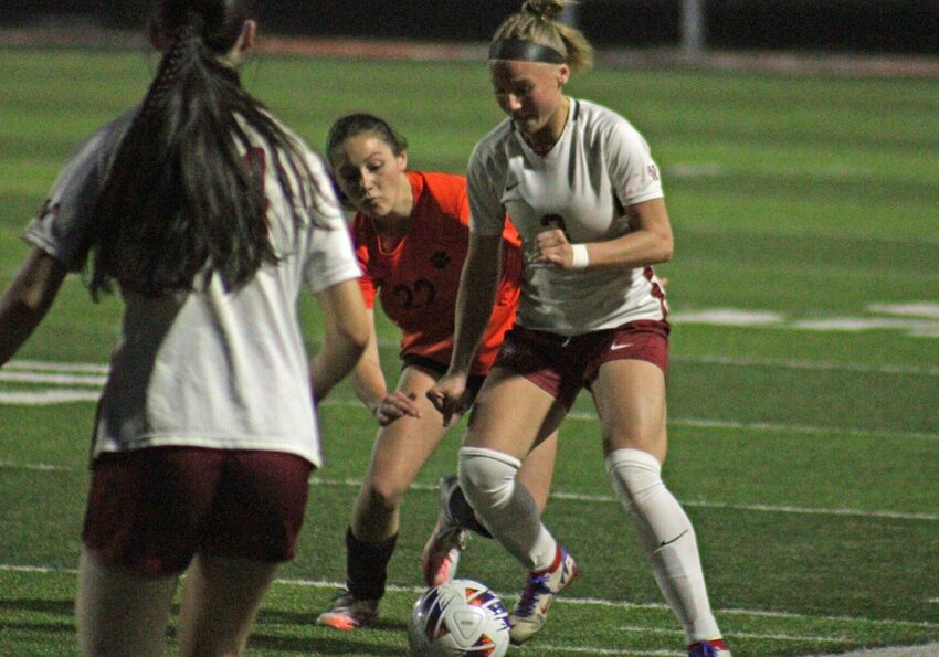 Warrensburg senior Gabby Fatka dribbles the ball against Oak Grove on Thursday, March 27, at at Oak Grove High School.