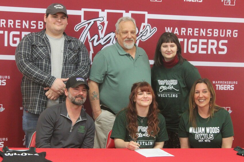 Warrensburg senior Avah Hall signed her letter of intent to wrestle at William Woods University on Friday, March 28,a t Warrensburg High School.
