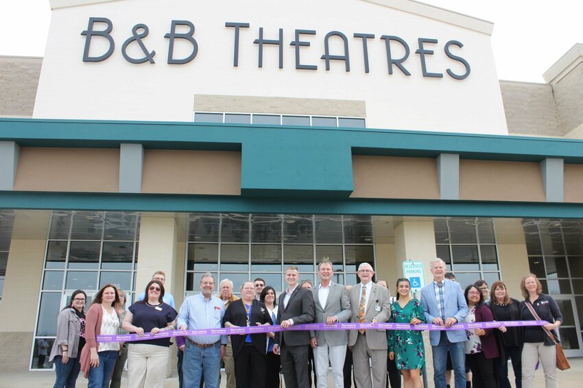 Representatives of B&amp;amp;B Theatres and Warrensburg Chamber members gather for the ribbon cutting ceremony on Thursday, March 27, at the B&amp;amp;B Theatres in Warrensburg.