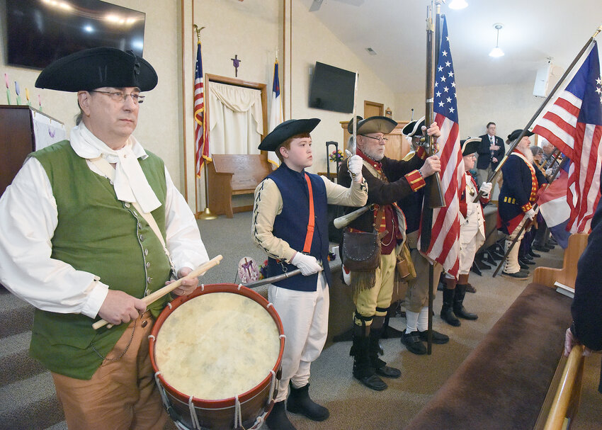 On Saturday, April 19, Northwest District MOSSARR Color Guard members present the Colors during the Liberty Tree Planting Ceremony at Hopewell Baptist Church. Initially slated for Hopewell Cemetery, SAR brought the ceremony inside the church due to inclement weather.