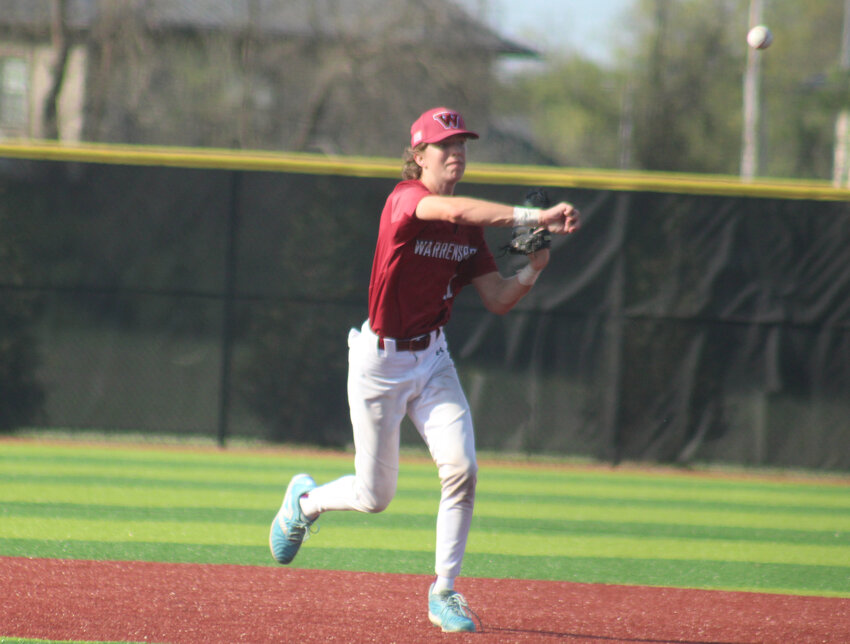 Warrensburg junior third baseman Kellen Frey throws the ball to first during a game against Center on Tuesday, April 22, at the Warrensburg Activities Complex.