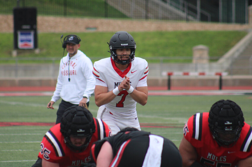Central Missouri senior quarterback Jordan Pachot goes through a presnap at the line of scrimmage on Saturday, April 26, at Walton Stadium.