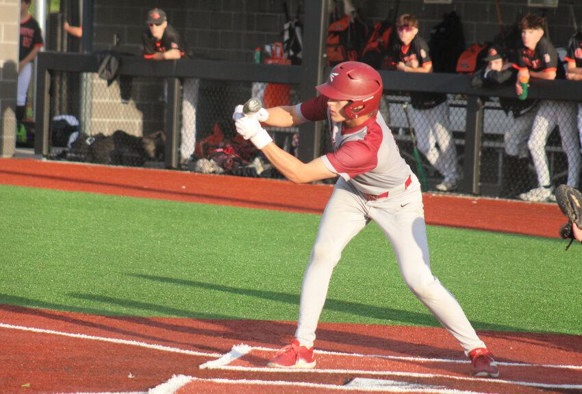 Warrensburg senior Carter Johnson lines a bunt against Oak Grove on Tuesday, April 29, at the Warrensburg Activities Complex.