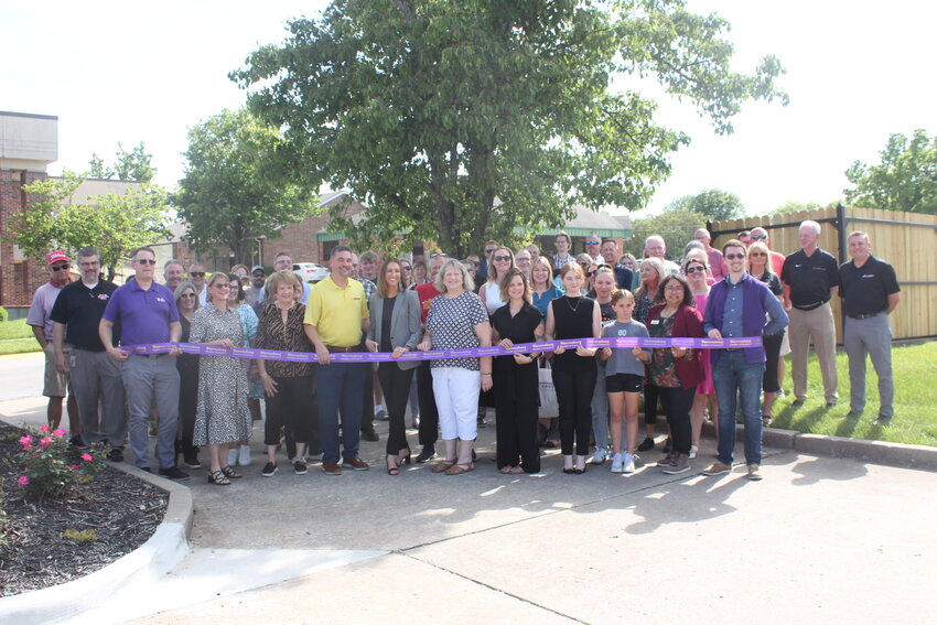 Lotspeich Law, LLC owner Amanda Lotspeich cuts the ribbon for her law firm on Tuesday, May 13, at Lotspeich Law, LLC in Warrensburg. The firm opened in January and held off celebrating with the community until Tuesday.