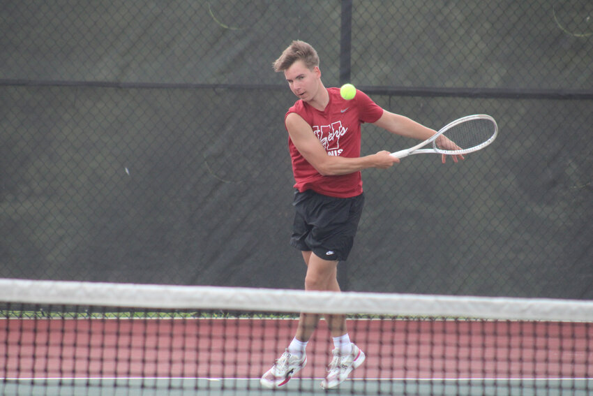 Warrensburg junior Noah Blum attacks the ball during the indiviudal singles district tournament Friday, May 2, at the Warrensburg Activities Complex.