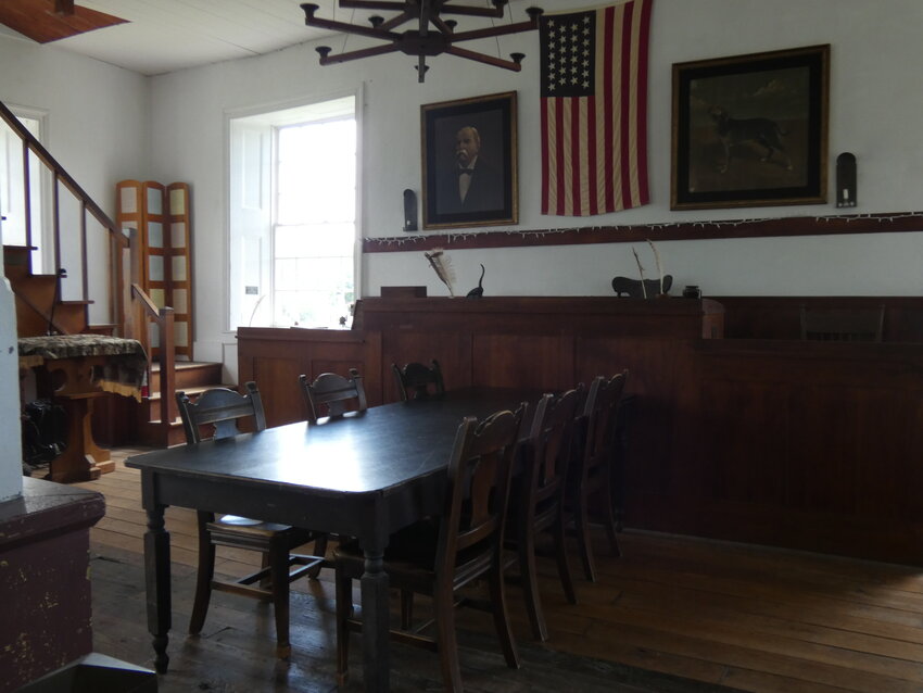 The historic Johnson County Courthouse on the Old Town Square at 302 N Main St. is further restored by the return of the original courthouse table. The table photographed was used during the case of Burden vs. Hornsby in 1869 by the council that decided upon the justice of the Old Drum court case.