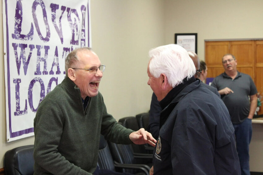cutline: Founding director and President of the Depot Renovation, Reservation and Maintenance Corporation William "Bill" Bernier, left, laughs next to MHTC Commissioner Robert Brinkmann of Defiance, right, in Dec. 2023, during the Missouri Highways and Transportation Commission’s visit to Warrensburg.