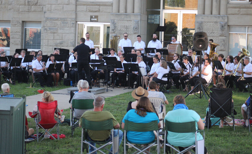 Highlighted by trombone, tuba and baritone musicians, the low brass section performs a tune during the Warrensburg Community Band’s Johnson County Courthouse concert  Saturday, June 14. .