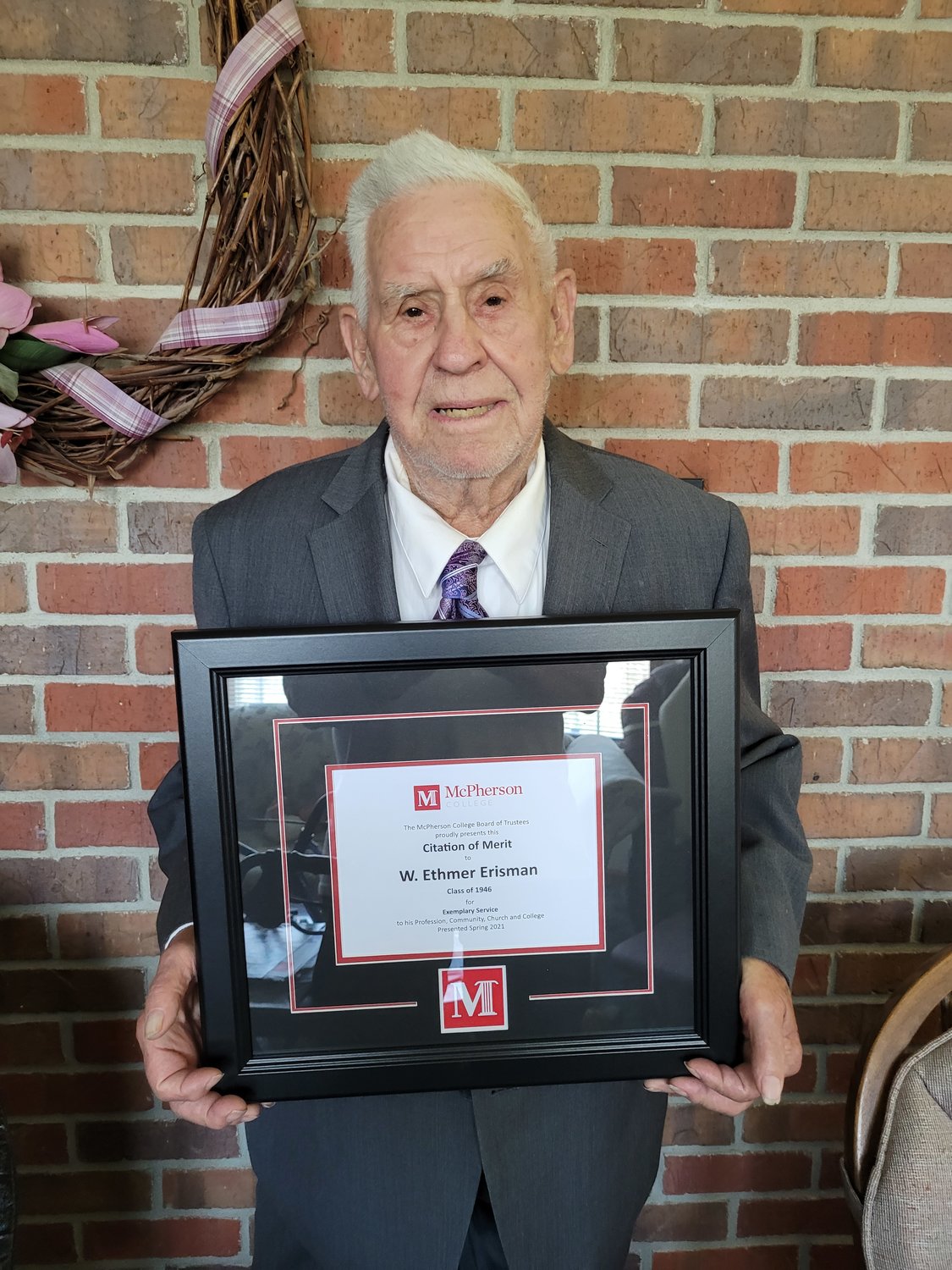 W. Ethmer Erisman receives the McPherson College Citation of Merit Award.