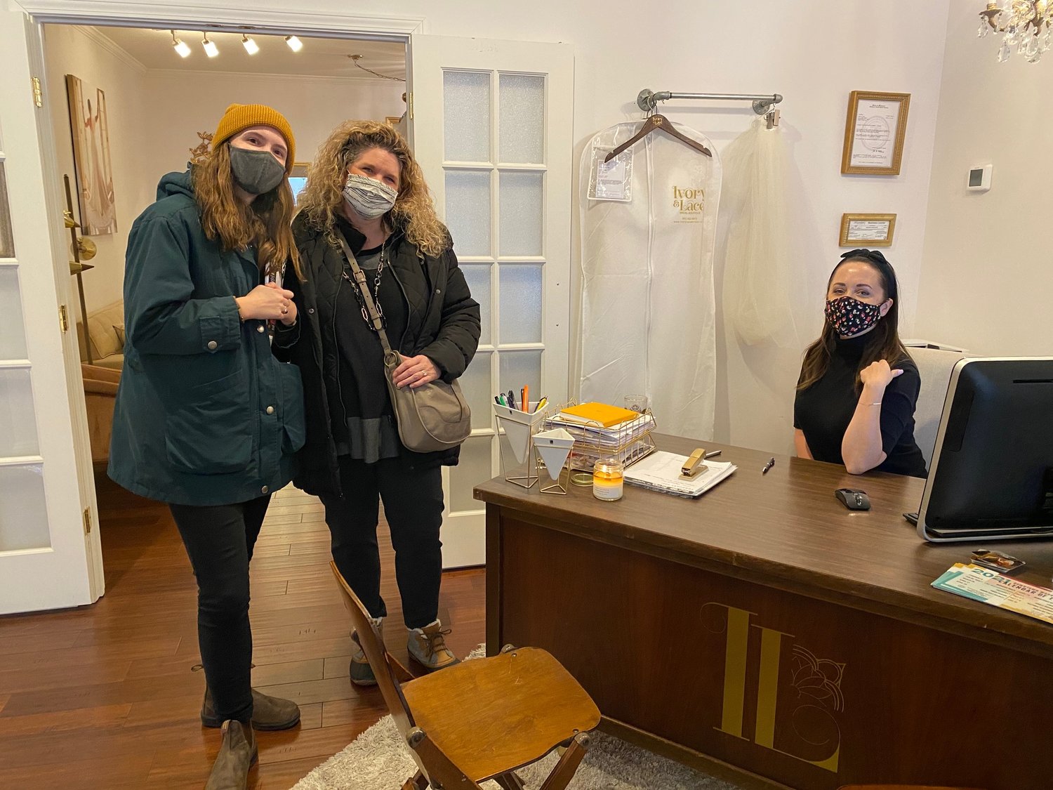 Riley Barry and Jill Purvis visit with Rachel Mifflin during the 2021 Downtown Wedding Walk at Ivory and Lace Bridal Boutique