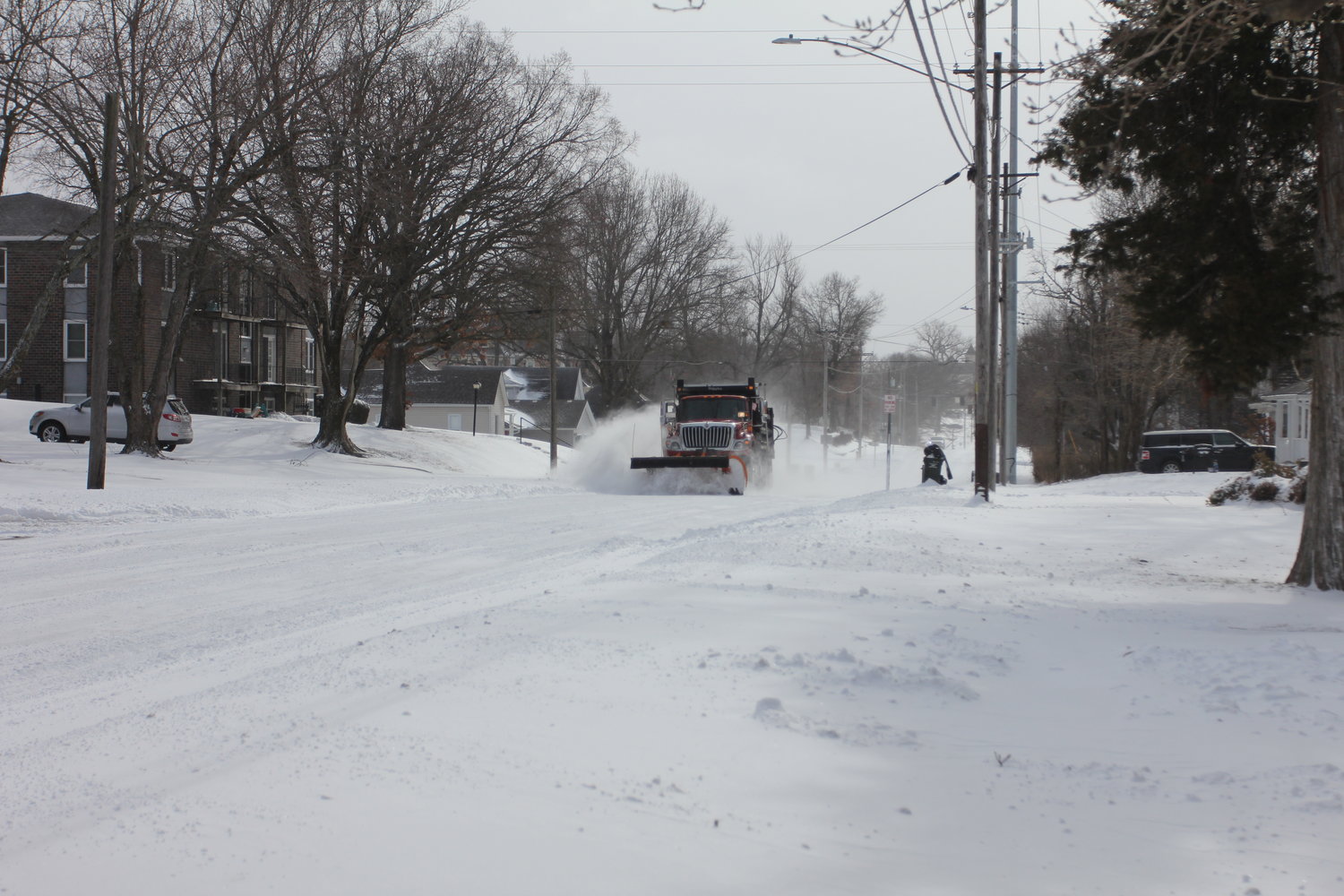 A snow plow clears the emergency snow route on Wednesday, Feb. 2, on North Holden Street in Warrensburg.