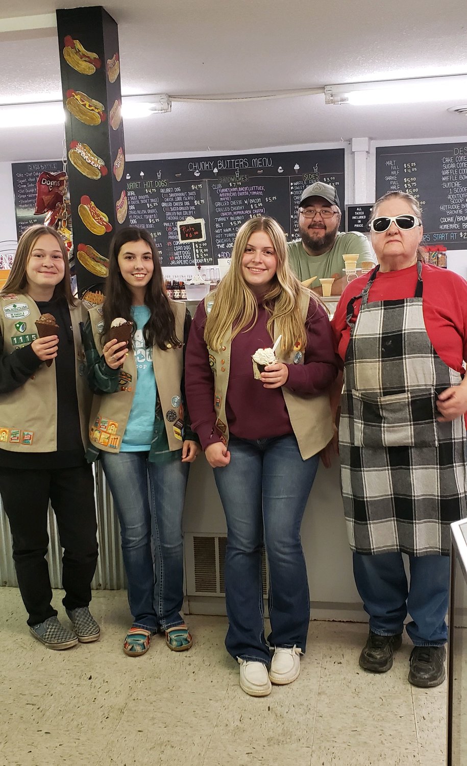 Members of Girl Scout Troop 1115 enjoy locally sourced ice cream at Chunky Butters in downtown Holden. Chunky Butters also serves other dishes such as hot dogs, fries, and grilled sandwiches.