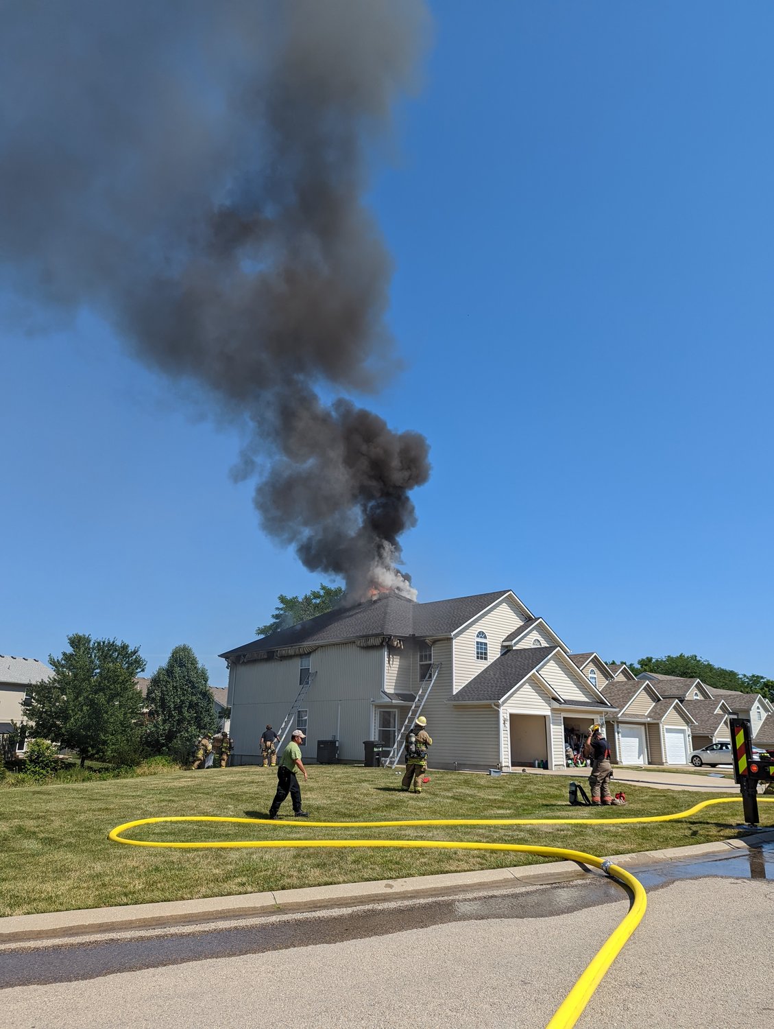 Firefighters work the scene of a structure fire Sunday, July 10, at a duplex in the 1200 block of Pebblecreek Drive.