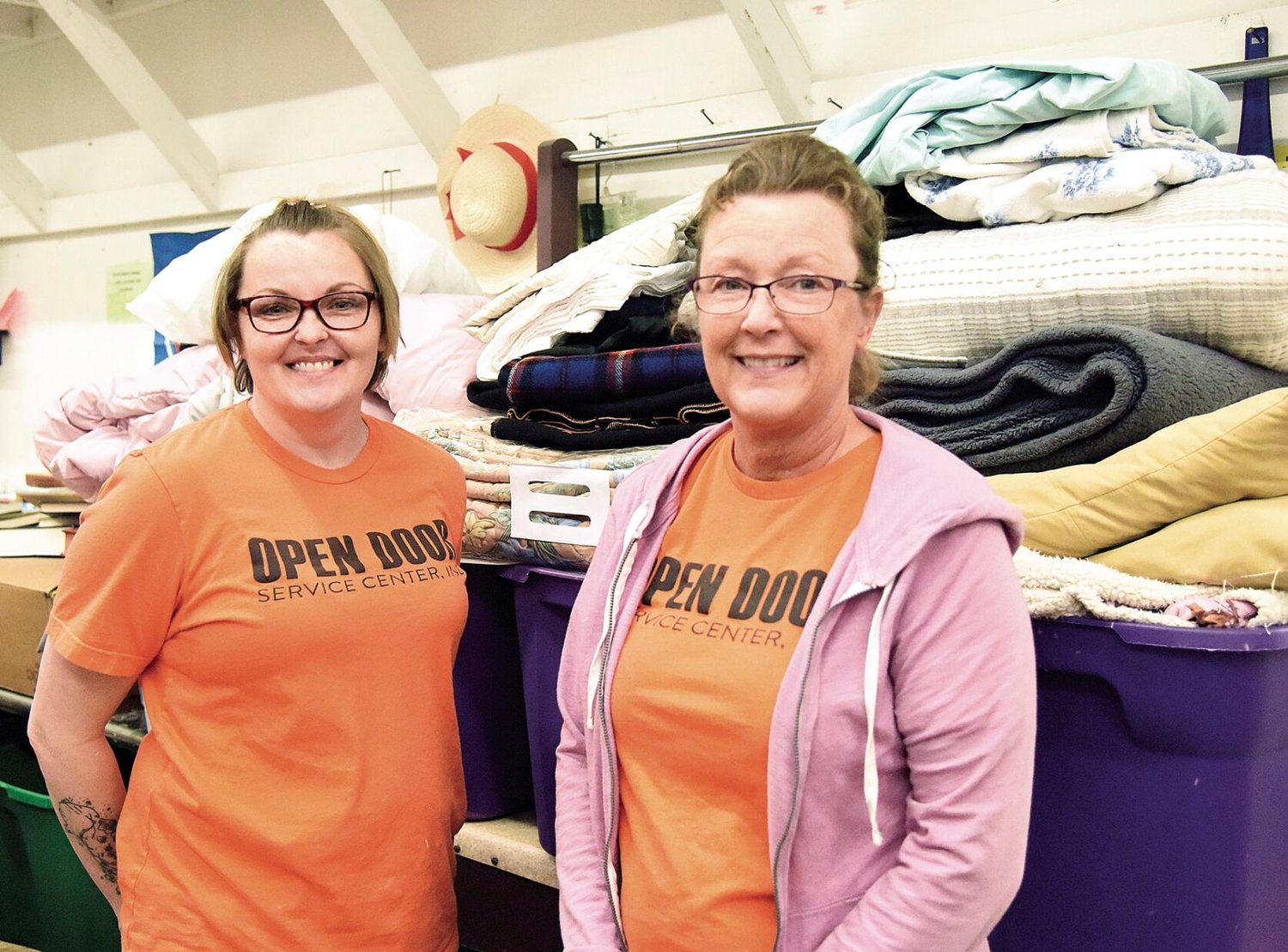 Open Door Thrift Store Manager Mary Spalding, left, and Assistant Manager Jan Patton stand with blankets at the store on Thursday, March 2. The pair noted they need donations of blankets to send to earthquake victims in Turkey.