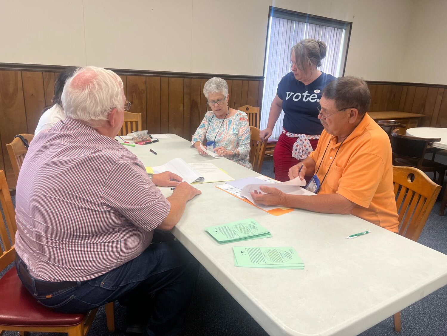 Kim Holger clarifies numbers with County Clerk Diane Thompson during the final vote tally for the special election on Tuesday, Aug. 8. 