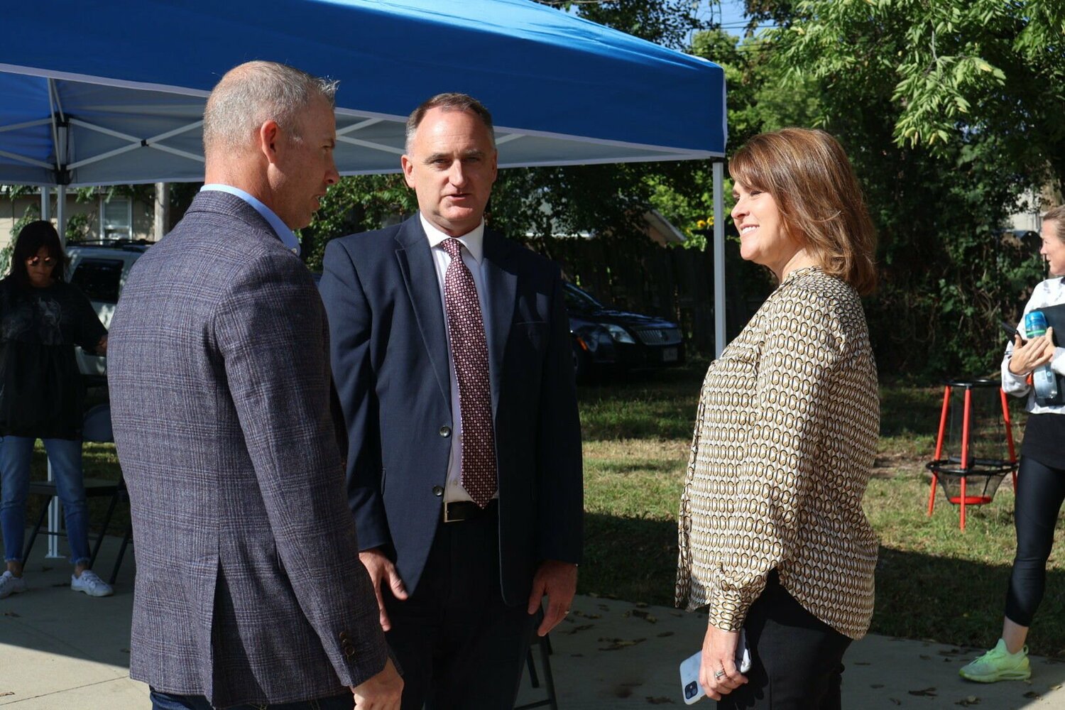 From left, State Sen. Rick Brattin, Johnson County Associate Circuit Judge Brent Teichman and Nora Bock, director of the Division of Behavioral Health for the Missouri Department of Mental Health, talk at the National Recovery Month celebration hosted by Recovery Lighthouse on Tuesday, Sept. 12. 