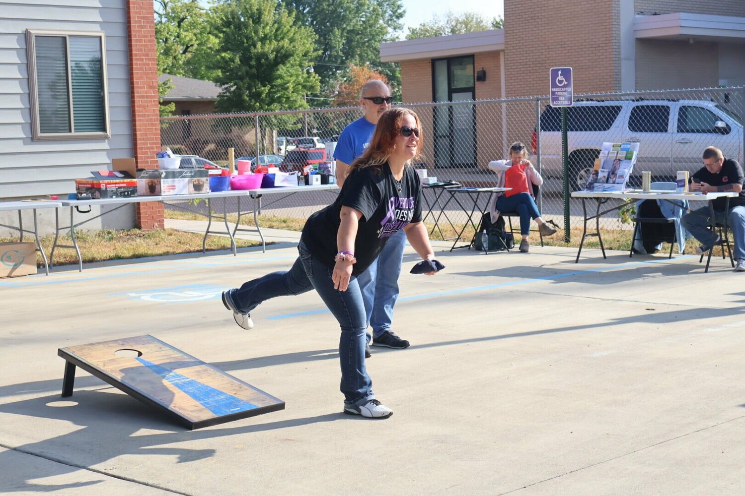 A woman plays corn hole at the Recovery Lighthouse 18th annual Recovery Month celebration on Tuesday, Sept. 12.


 