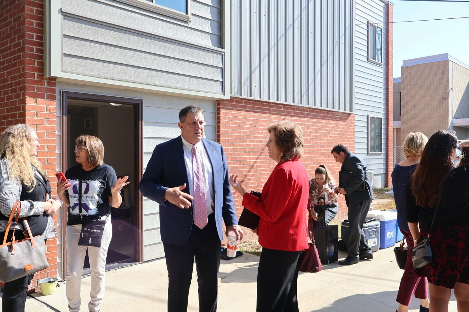 Johnson County Prosecuting Attorney Robert Russell and former Congresswoman Vicky Hartzler converse at the 18th annual Recovery Month celebration on Tuesday, Sept. 12.