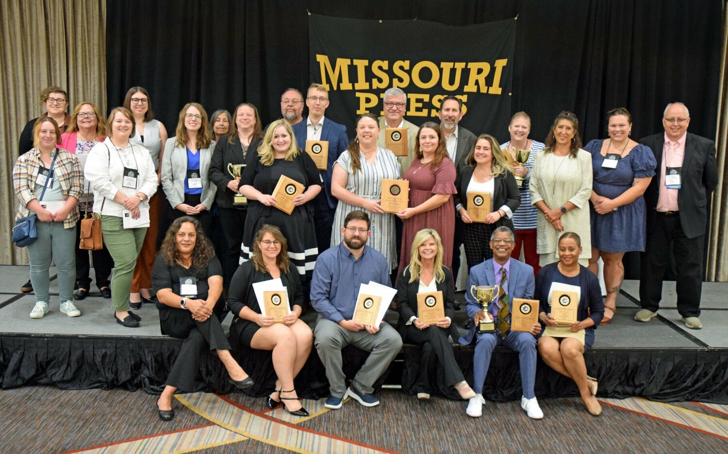 Staff members from the weekly newspapers present at the Missouri Press Association awards luncheon pose for a photo Saturday, Sept. 23.