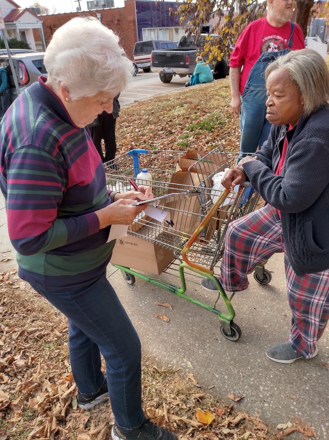 Volunteers distribute food items at a previous Christmas Store event. This year's Christmas Store will be hosted in mid-December at the Bethlehem Lutheran Church.