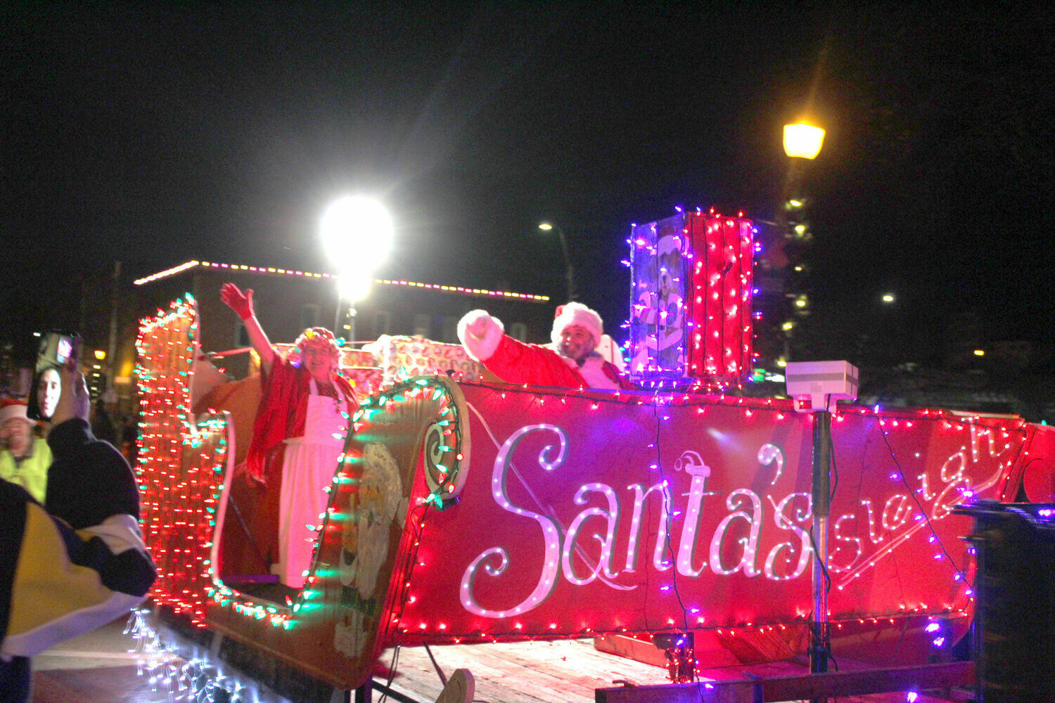 Santa and Mrs. Claus arrive in downtown Warrensburg in Santa’s sleigh during the Holiday Parade on Friday, Dec. 2, 2022. The sixth annual Holiday Parade will be hosted at 6 p.m. Friday, Dec. 1 in downtown Warrensburg.