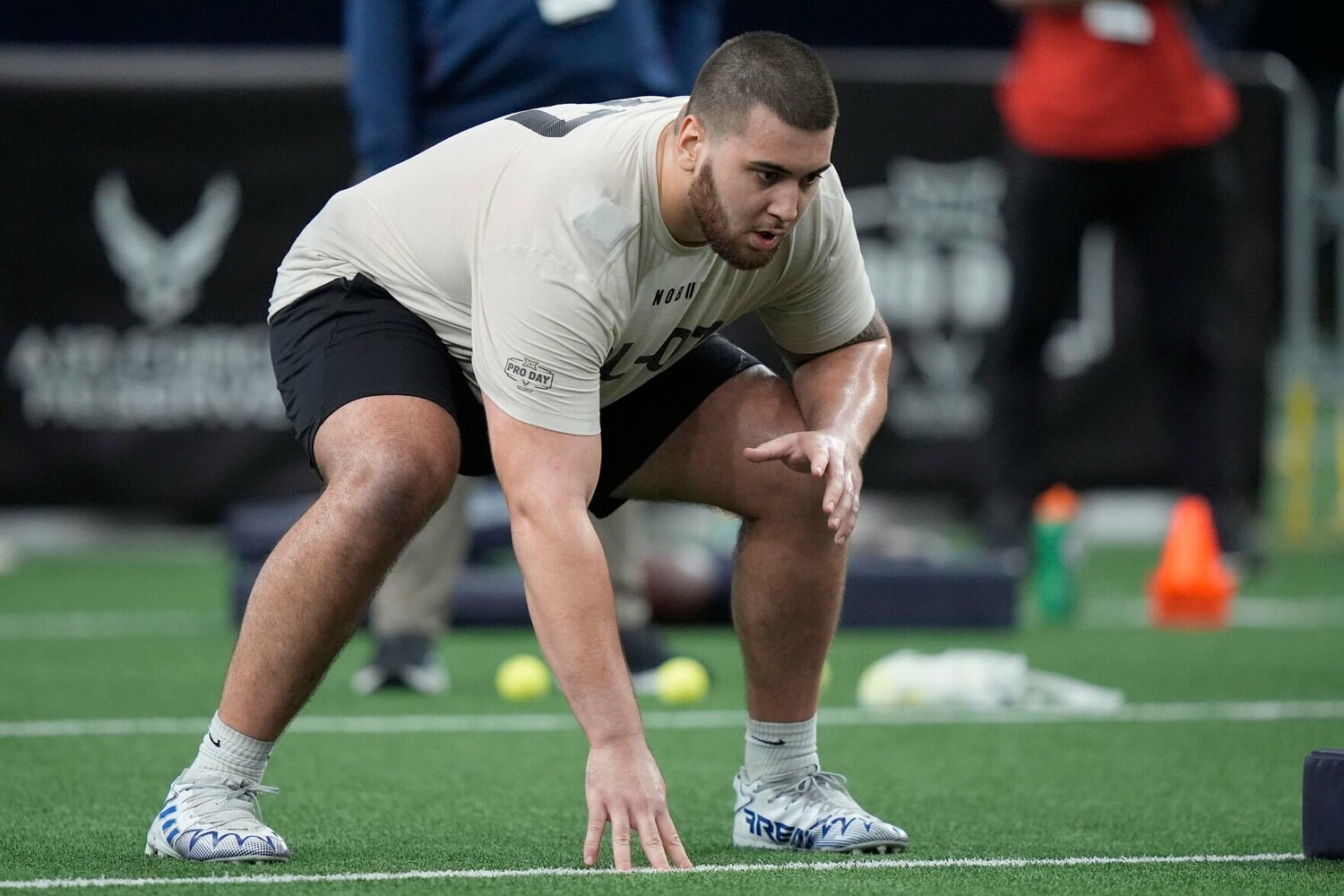 Kansas offensive lineman Dominick Puni lines up for a drill during Big 12 NCAA college NFL football pro day Saturday, March 30, 2024, in Frisco, Texas.