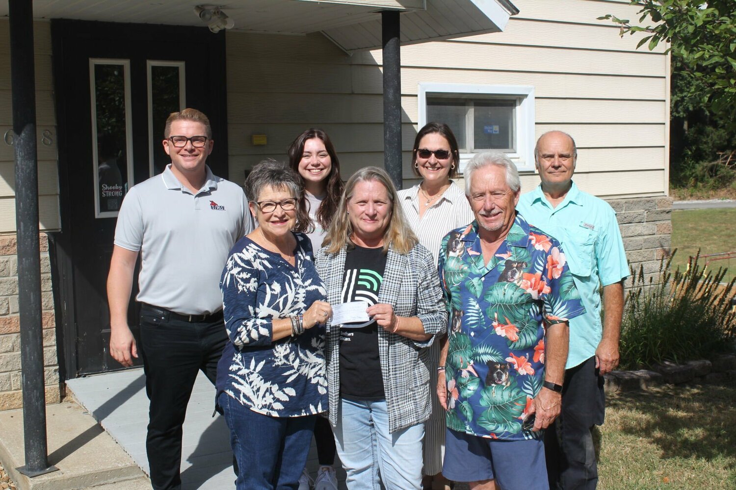 Big Brothers Big Sisters Executive Director Dana Phelps, front center, receives a $1000 check from Diane Whitworth, front left, of the Blaine Whitworth Foundation and her husband Barry Whitworth, front right, on Wednesday, Sept. 18, at the Big Brothers Big Sisters office. Also pictured from back left are BBBS Board Member Tyler Habiger, BBBS Match Specialist Camryn Cummings, BBBS Board Treasurer Michelle Schubert and BBBS Board Member Eddie Chitwood.