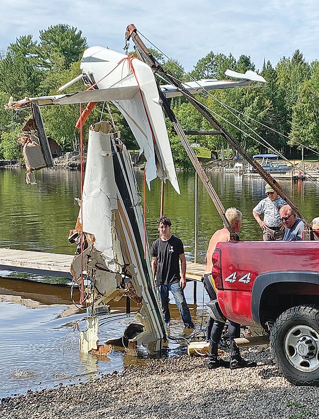 The wreckage of an airplane that crashed into White Iron Lake last week was brought ashore late Tuesday.