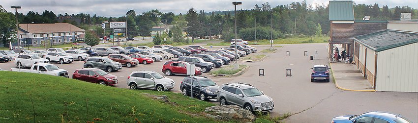 Dozens of cars nearly fill the Shopko parking lot for last Sunday&rsquo;s sermon by Pastor Eric Thiele.