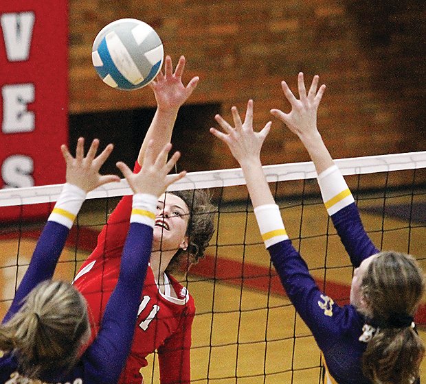 Ely&rsquo;s Rachel Coughlin goes up high for a kill on Tuesday as the Wolves downed the Broncos in straight sets.