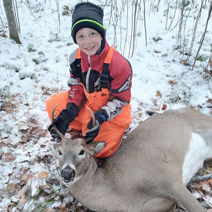 Ten-year-old Kolton Orcutt shows off his first buck.