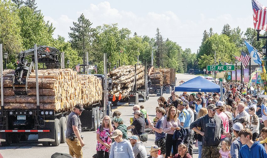 Logging trucks brought up the rear of a 40-minute Timber Days parade on Sunday, passing by a large and enthusiastic crowd.