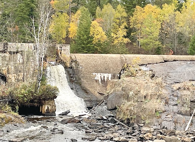 Water is again flowing through the middle spillway on the Pike River dam, a sign that water levels behind the dam have risen due to recent rains.