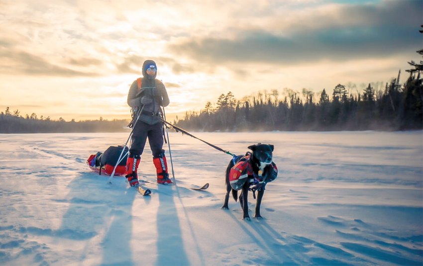 Emily Ford and her dog Diggins on a test run just ahead of her trek across the Boundary Waters.