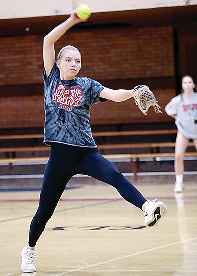 Ely pitcher Katrina Seliskar winds up during a recent indoor practice. Lingering snow and cold conditions have affected the springs sports   seasons in the area.