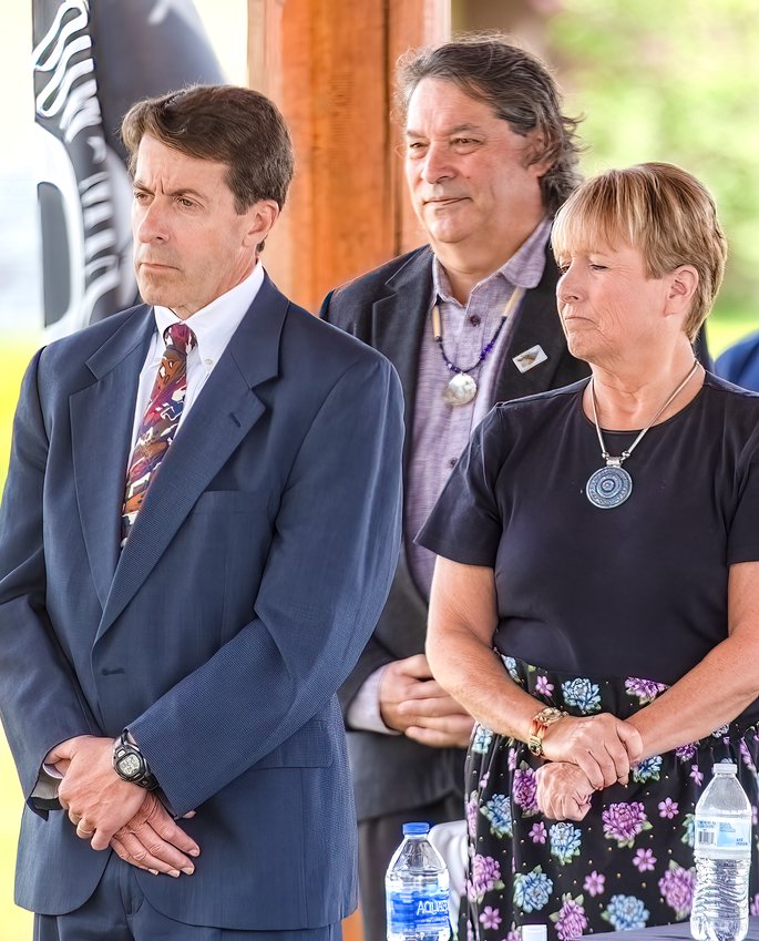 From left, The Conservation Fund CEO Larry Selzer, Indian Land Tenure Foundation President Cris Stainbrook, and Bois Forte Chairperson Cathy Chavers listen to the Bois Forte Singers perform during Tuesday's land restoration ceremony at Nett Lake.