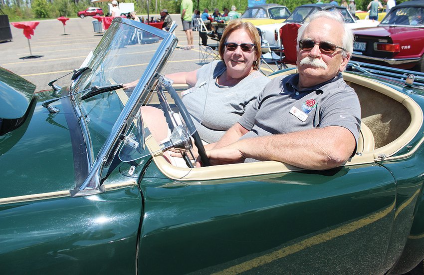 Dennis and Theresa Oberloh, of Redwood Falls, sit in their 1958 MG convertible at the InterMarque Car Club&rsquo;s annual rendevous last weekend at Fortune Bay Resort Casino.