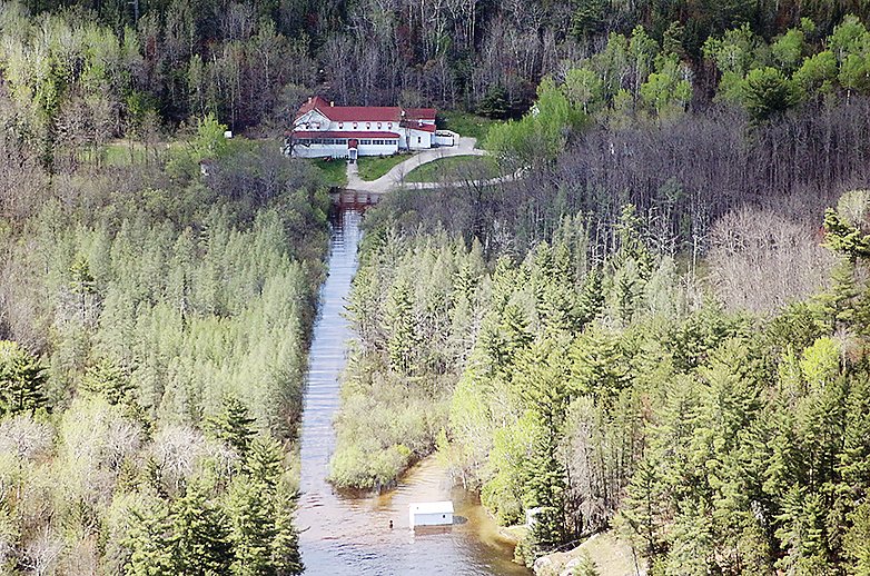 The historic Kettle Falls Hotel was surrounded by water during   recent high water. Levels have receded slightly since this   photograph was taken.  Flight courtesy Adventure Seaplanes.