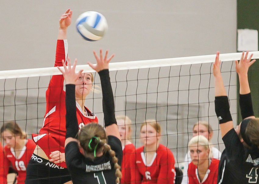 Ely junior Hannah Penke goes up high for a kill attempt Tuesday night in   Babbitt.