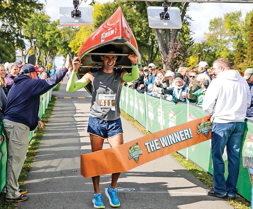Left:   Last year&rsquo;s canoe   portage marathon winner was looking good as he came across the finish line in Whiteside Park amidst a large crowd of cheering fans. It all kicks off again on Saturday with the seventh running of the Ely Marathon.