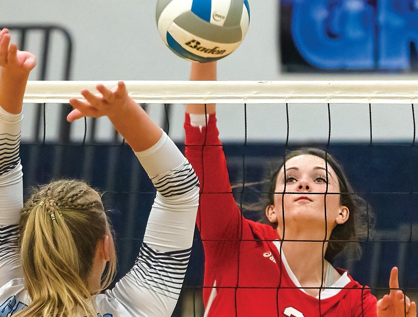 Ely senior Madeline Kallberg focuses as she goes up for a kill attempt during last Thursday&rsquo;s contest with North Woods.